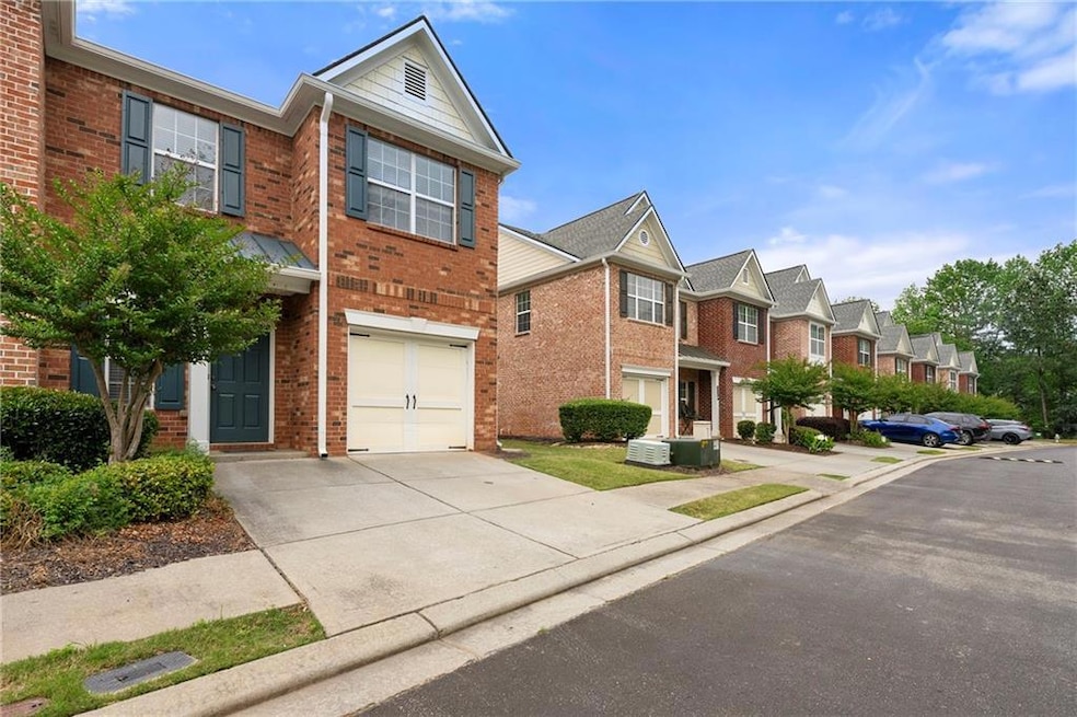 End Unit brick townhome with garage and driveway s