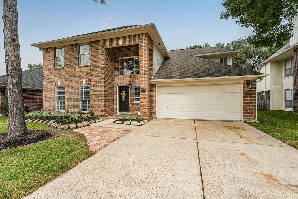 Welcome to 1113 Gulfton Drive! This two-story brick and Hardie plank home is situated in the Sunset Meadows community in Pearland ISD and it boasts a towering pine tree, rock-lined and freshly mulched landscape beds, keystone accents, and a double-wide driveway.