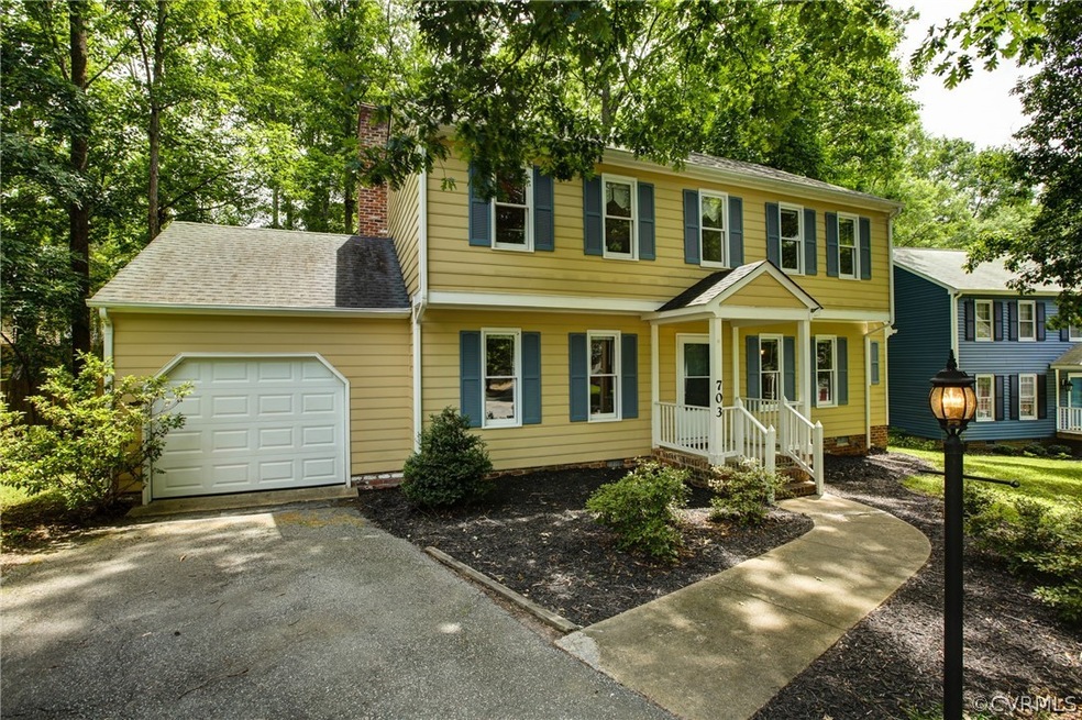 2-Story Colonial with attached garage.