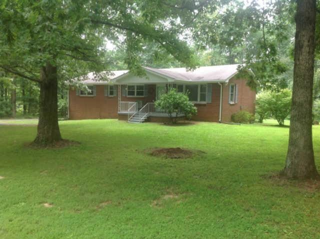 Beautiful inside and out  3.1 acres level and tree lined
