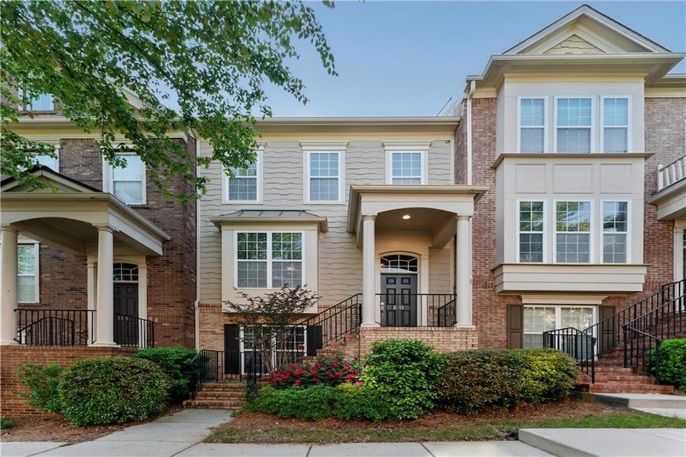 Townhome / multi-family property featuring stairs 