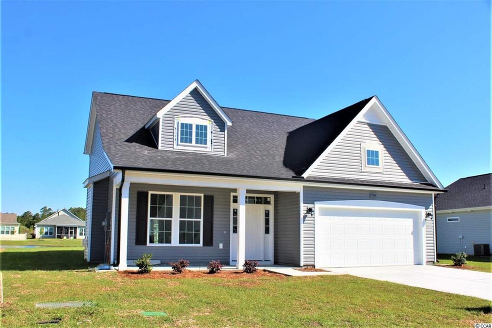 Large front porch, black gutters. Full landscaping