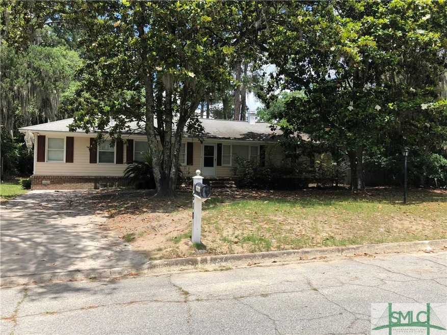 THIS LOVELY HOME SITS HIGH ABOVE THE STREET AND IS