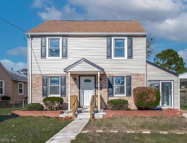 Updated with vinyl siding.  New front porch and ra
