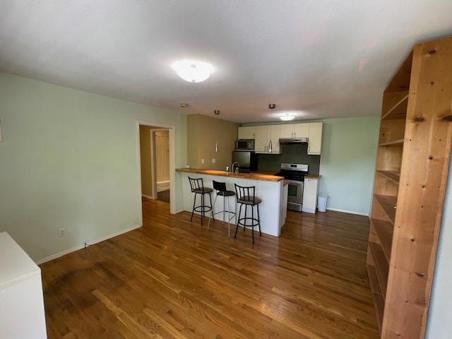 Kitchen with stainless steel appliances, under ca