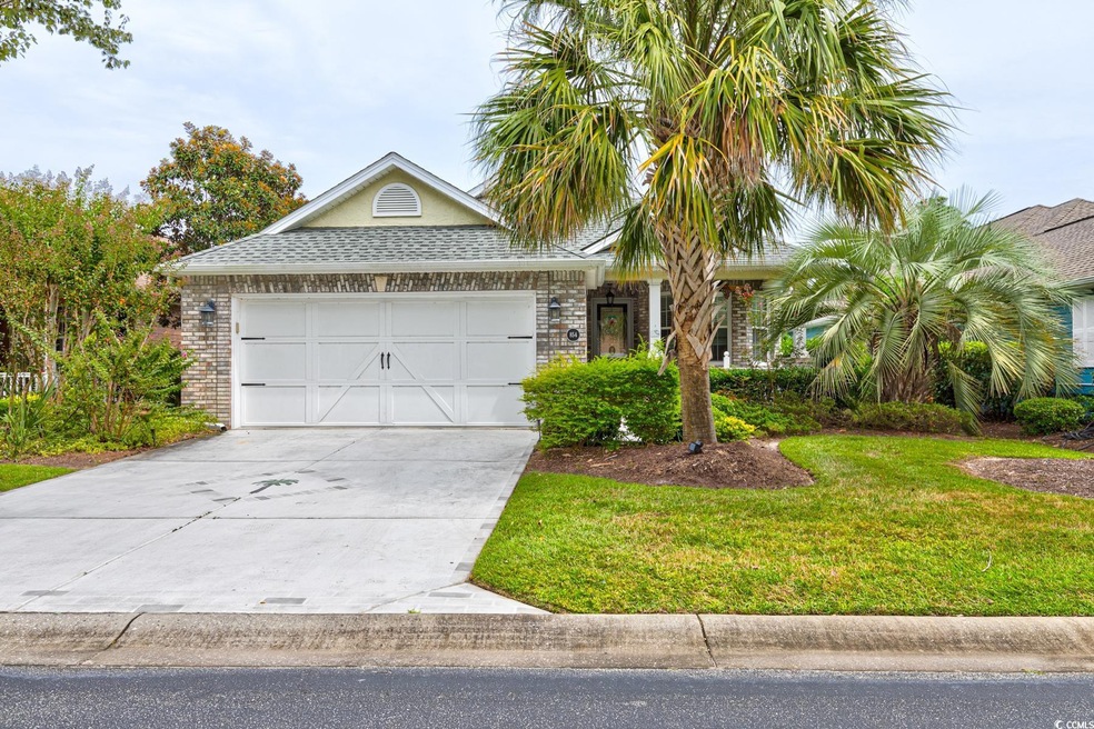View of front of house featuring a garage and a fr