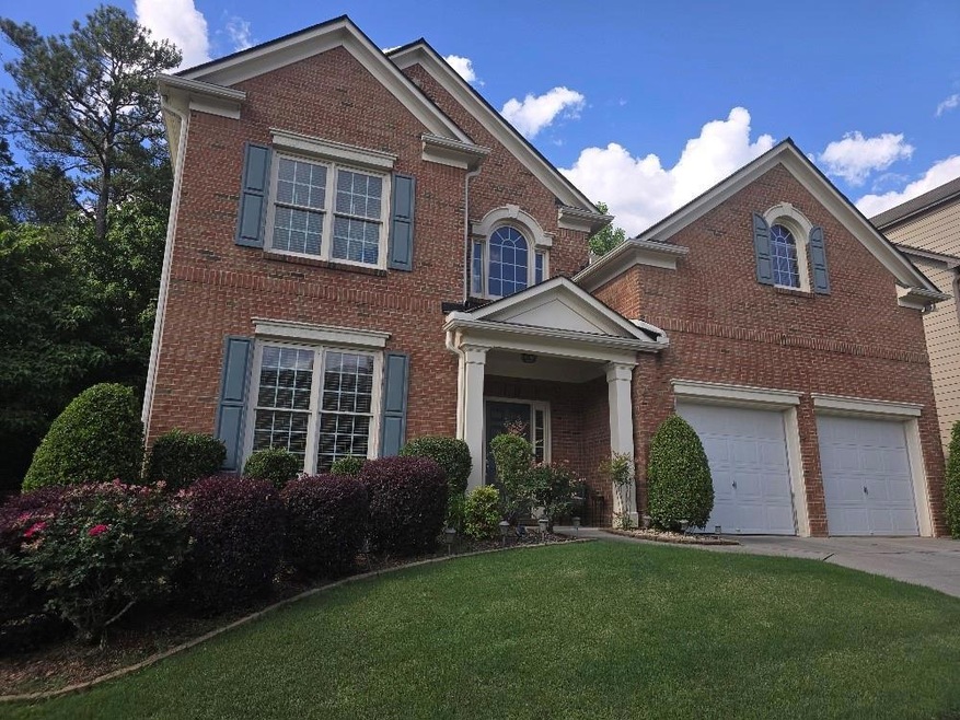 View of front of home featuring a garage and a fro