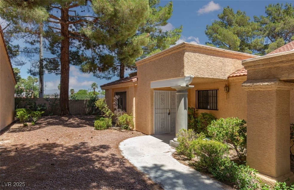 View of exterior entry featuring stucco siding