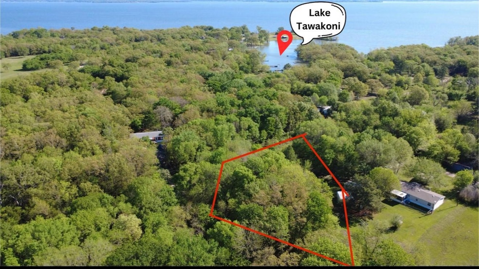 Aerial view featuring a water view and a view of t
