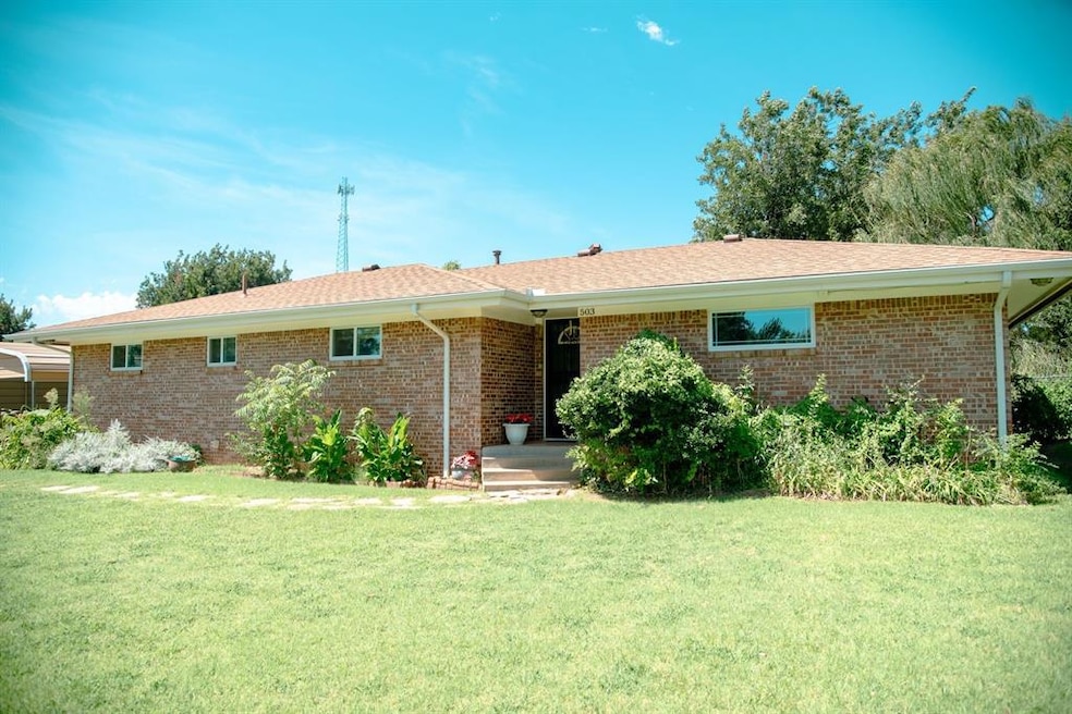 View of front of property with a front yard