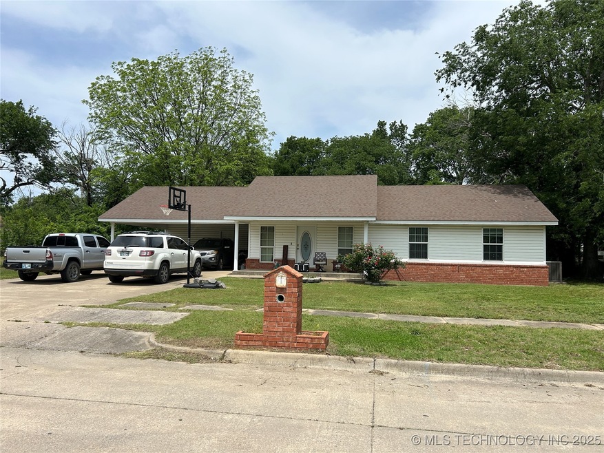 Ranch-style home featuring driveway, a front lawn,