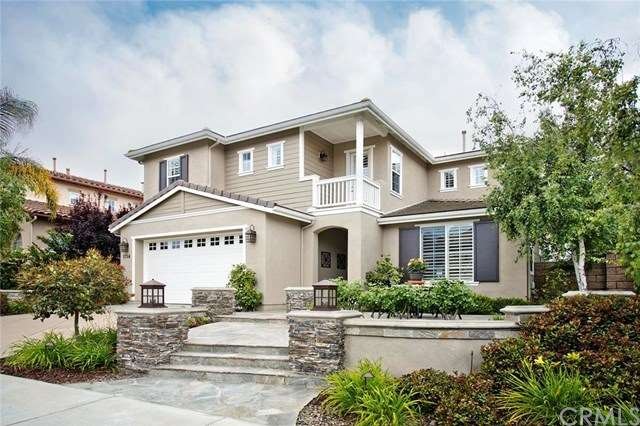 Professional hardscaping and lighting create a wel