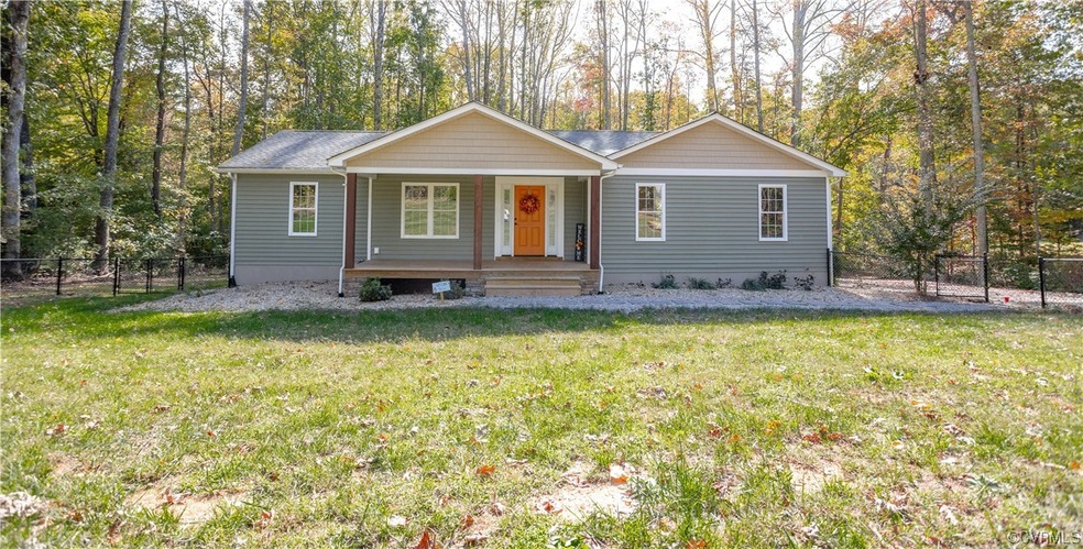 Single story home with a front lawn
