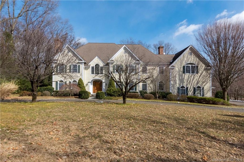 Horseshoe driveway off neighborhood street leads t