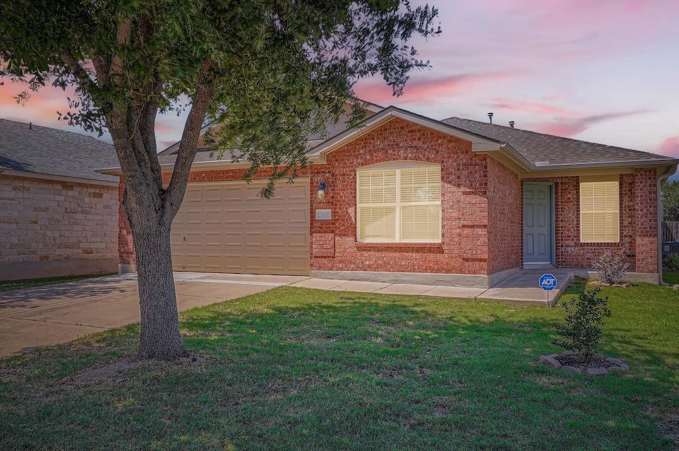 View of front of home with a garage, a shingled r