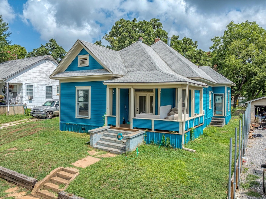 View of front of house featuring covered porch and