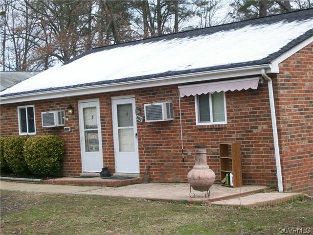 Middle all brick building. This building contains 