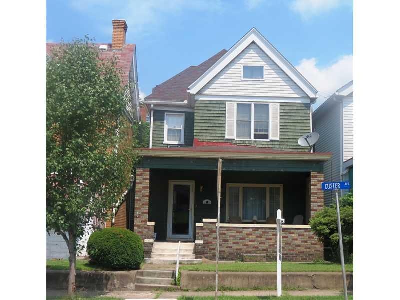 Exterior Front. This cedar and brick home is truly