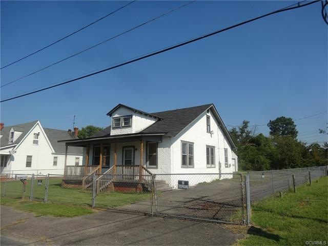 Front Elevation Showing Paved Drive and Parking