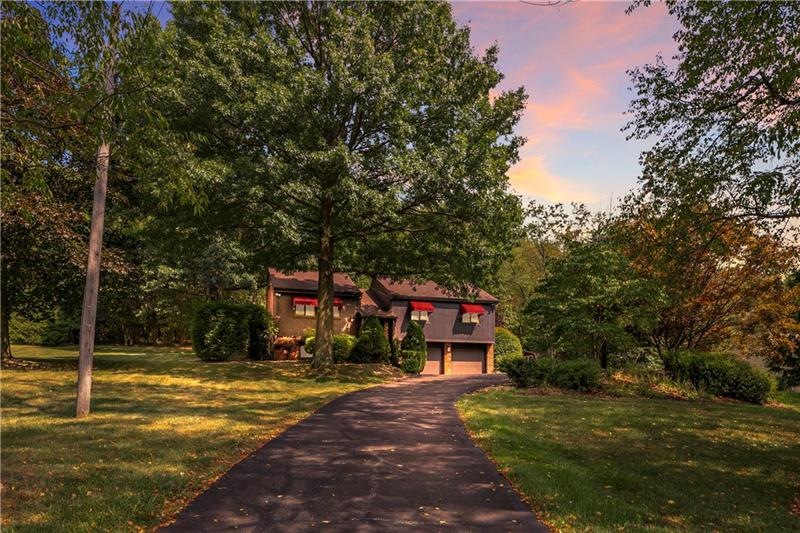 Beautiful Setting on a 1 acre lot! Home sits off o