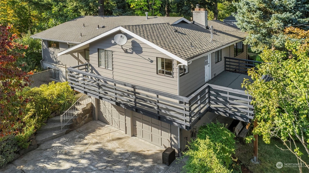 Front of house with wrap around deck.