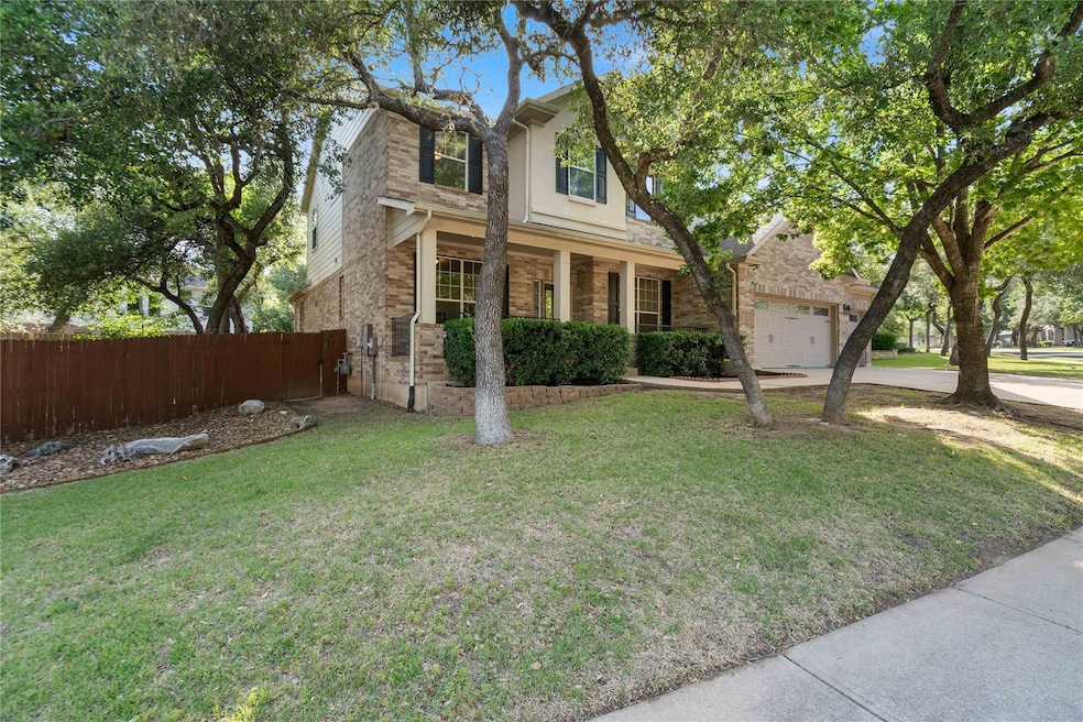 Traditional-style house with concrete driveway, a