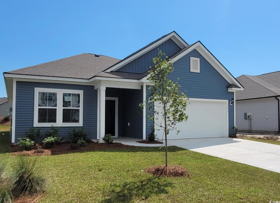 Craftsman-style house with a garage and a front la