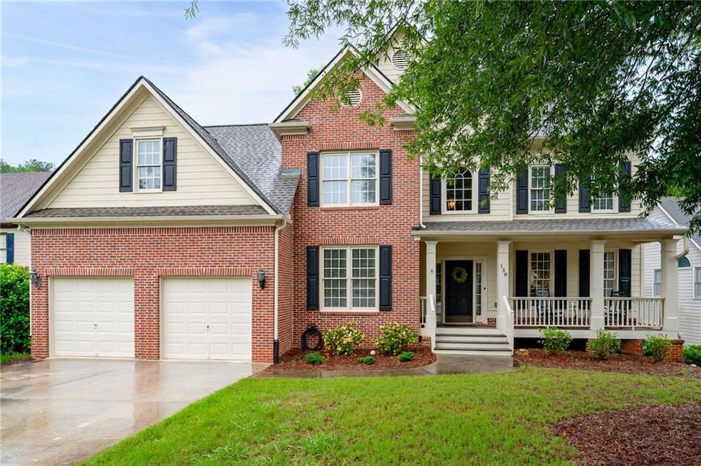 Cozy front porch with space for rocking chairs — perfect for relaxing.