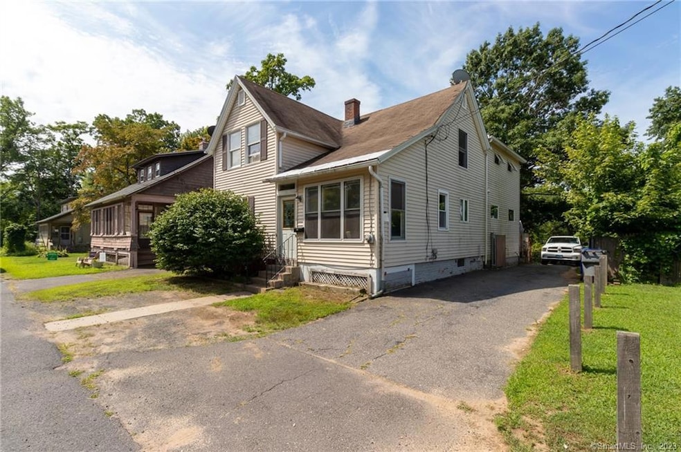 Front of home w/driveway to 3 car garage.