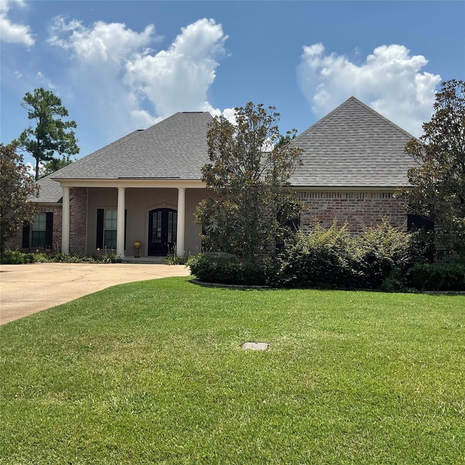 View of front of property with a front yard