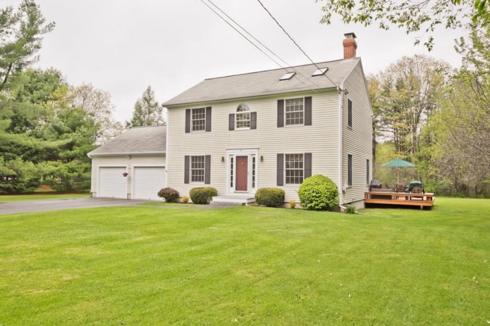 Front exterior view of large lawn...