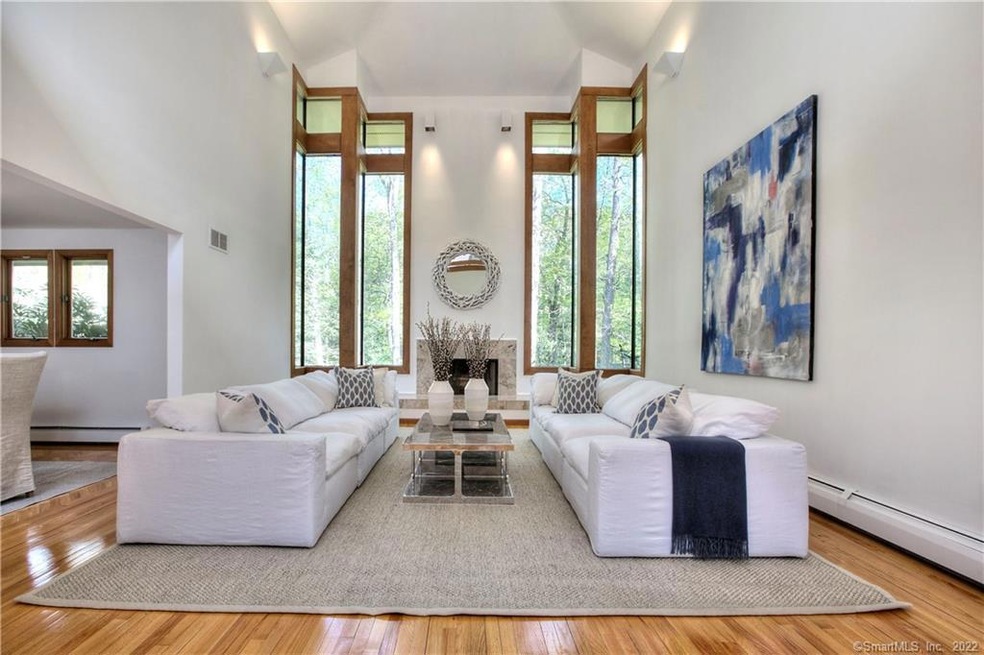 Gorgeous living room with dramatic windows, bring 