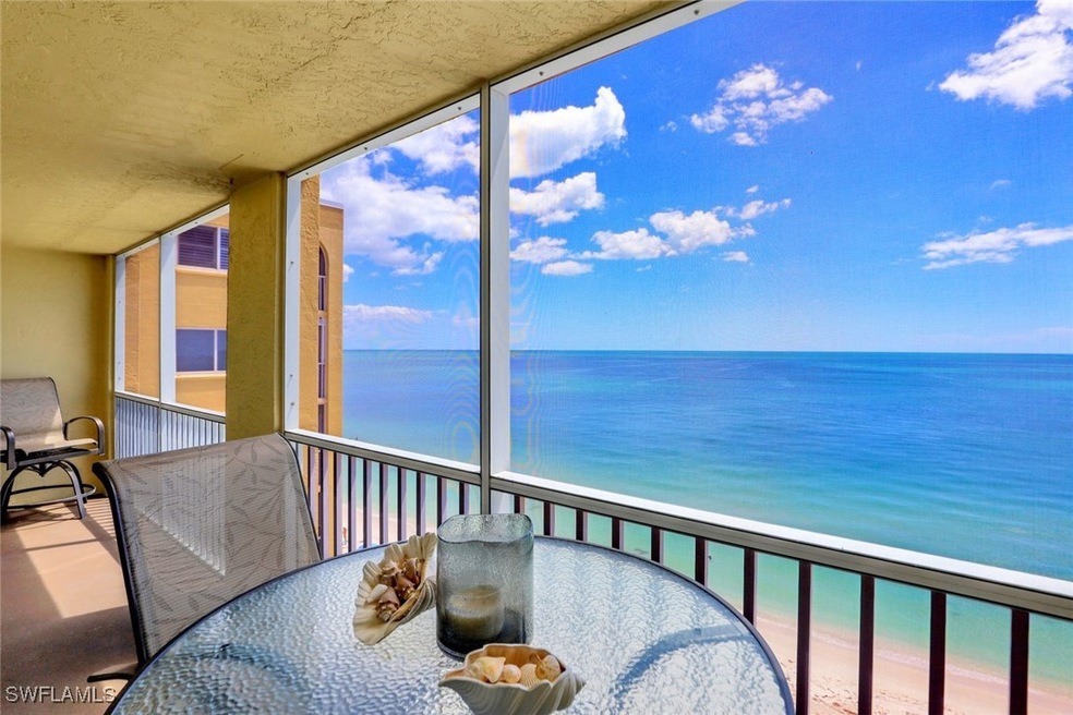 Sunroom / solarium with a water view and a beach v