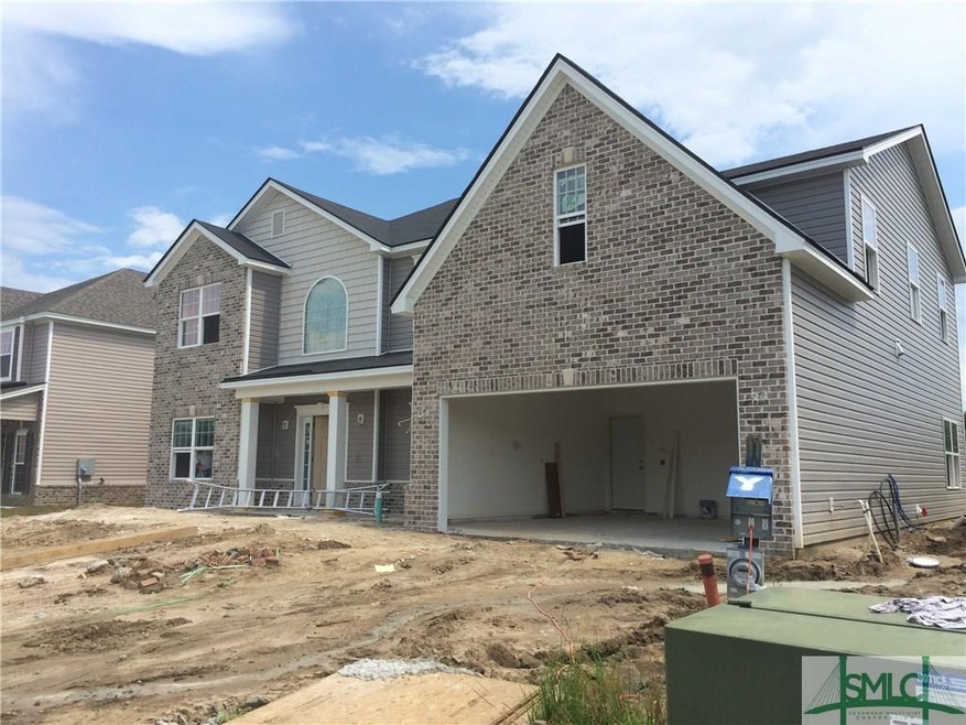 Beautiful exterior with brick accents, an extended