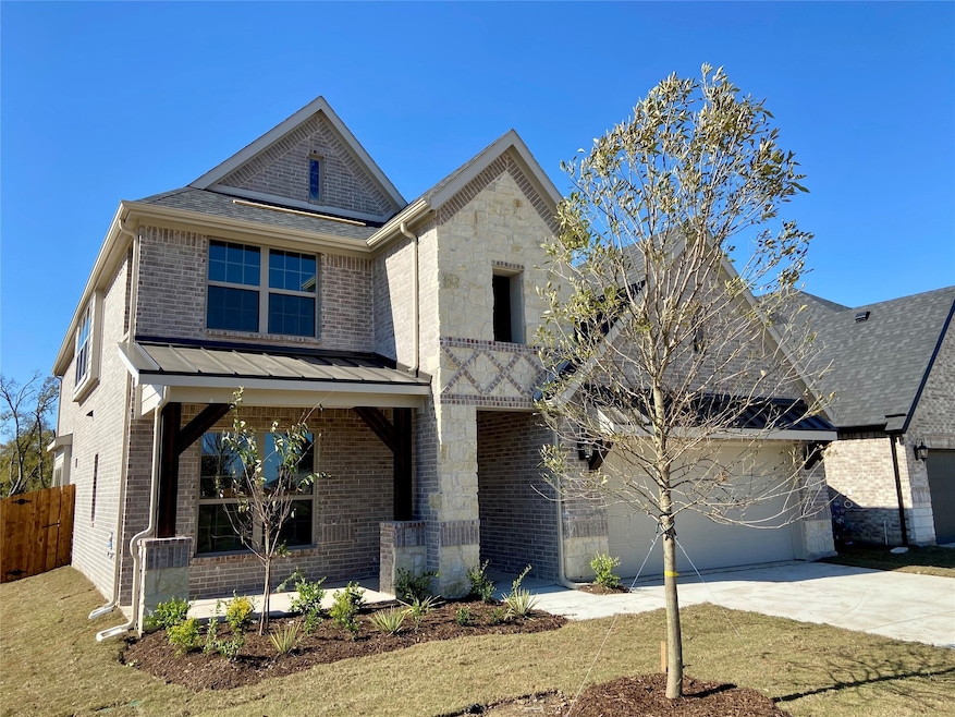 Beautiful new stone & brick home with metal roofs & cedar posts backs to Nature Area!