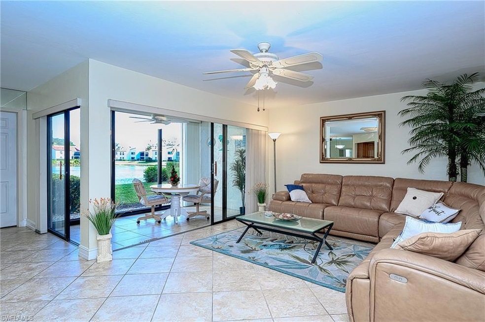 Living room area and lanai with expansive lake vie
