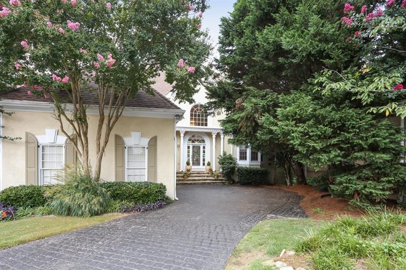 Hardcoat Stucco. This stately home is in a pretty 