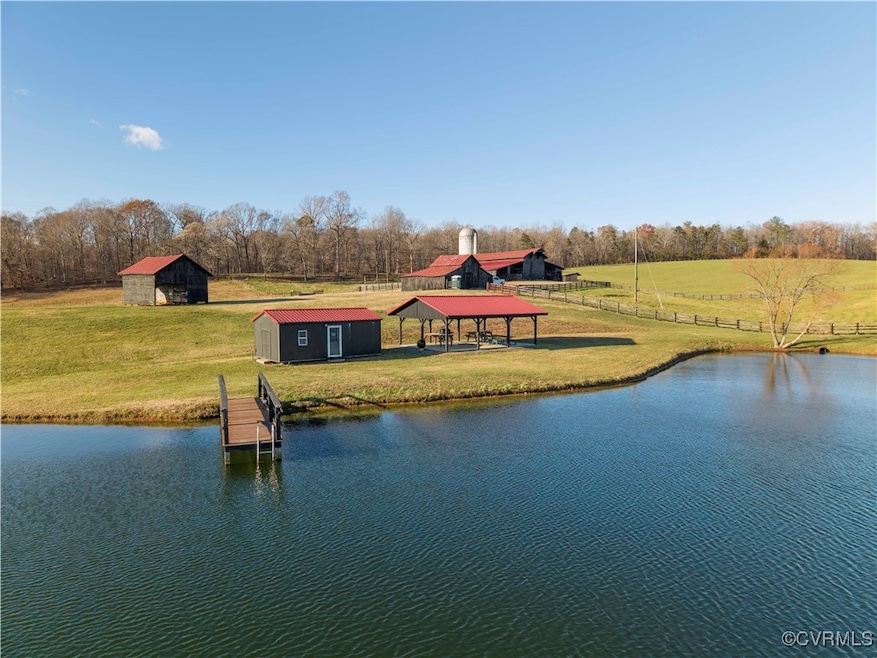 Water view with a gazebo and a rural view