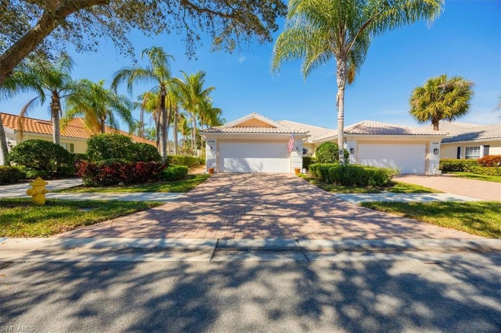 Mediterranean / spanish-style home with a garage