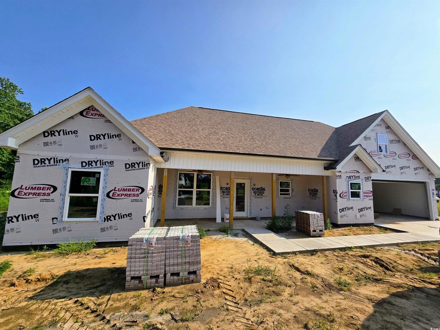 Unfinished property with a shingled roof and a garage