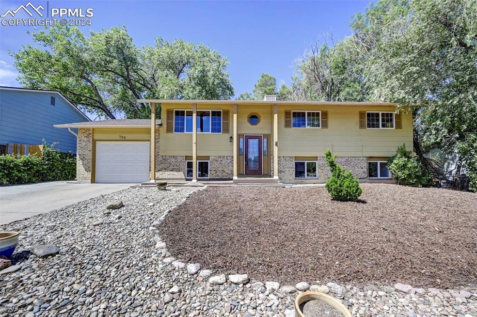 Raised ranch featuring a garage