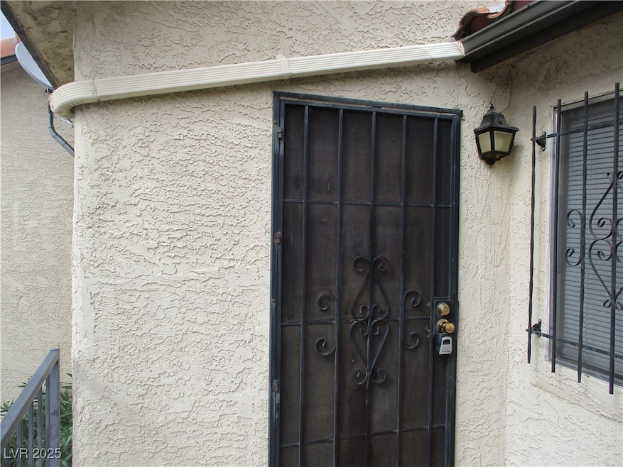 View of exterior entry with stucco siding