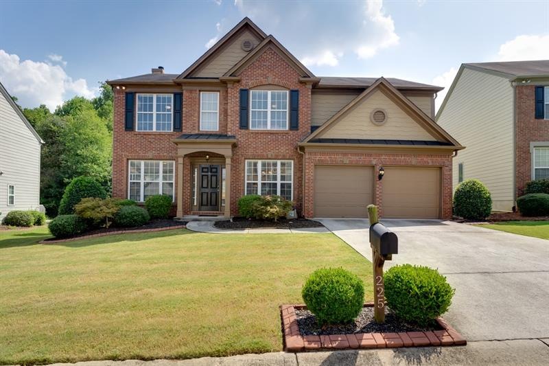Wonderful curb appeal with well manicured landscap