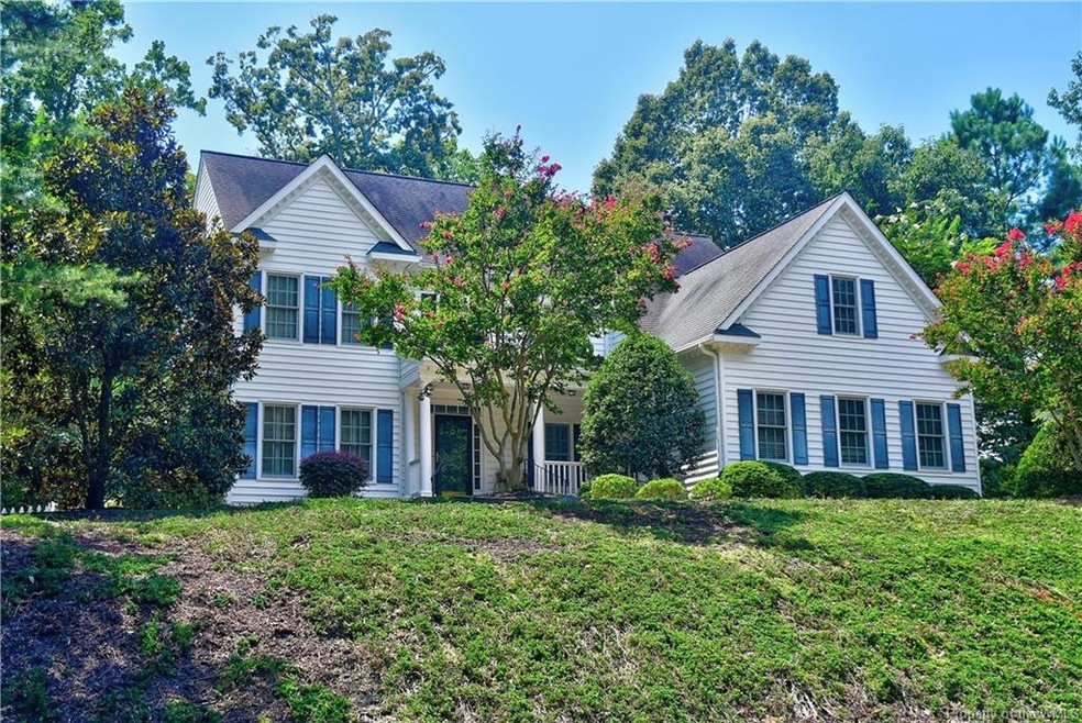 This exquisite home is perched high on a hill surr