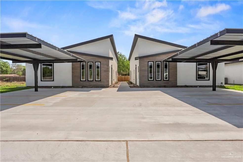 Rear view of property with stucco siding