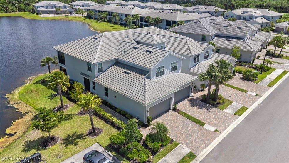 Drone / aerial view featuring a water view and a r