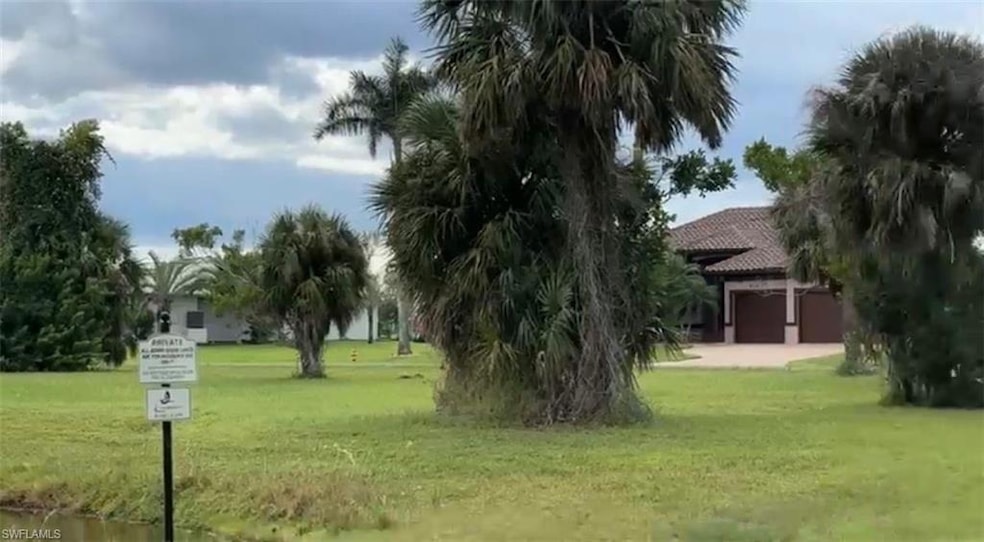 View of property's community featuring a yard