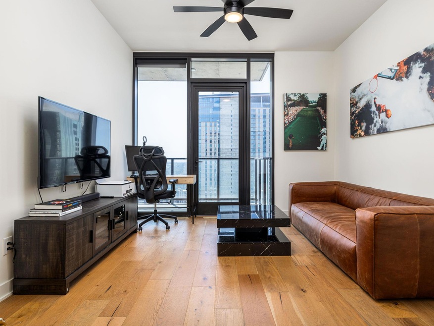 Office space with light wood-style flooring, a ce