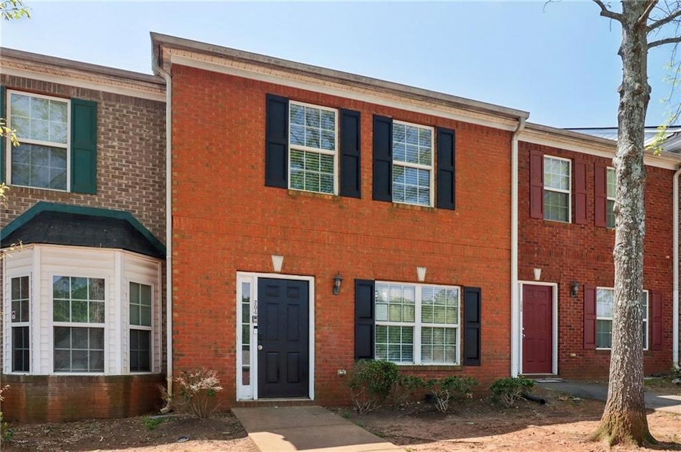 View of property featuring brick siding