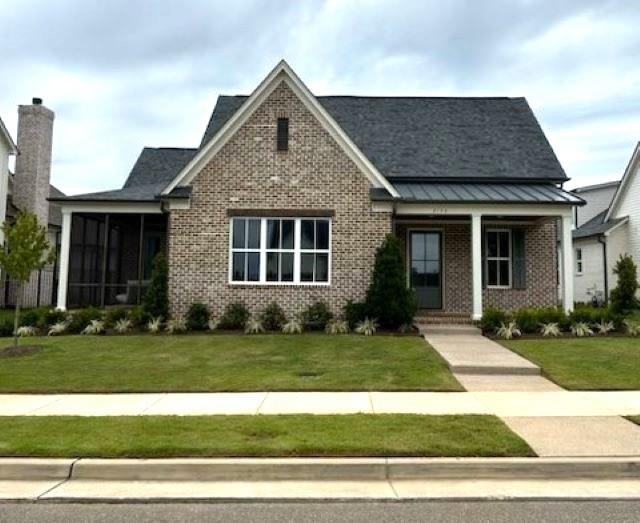 View of front of house with a front lawn